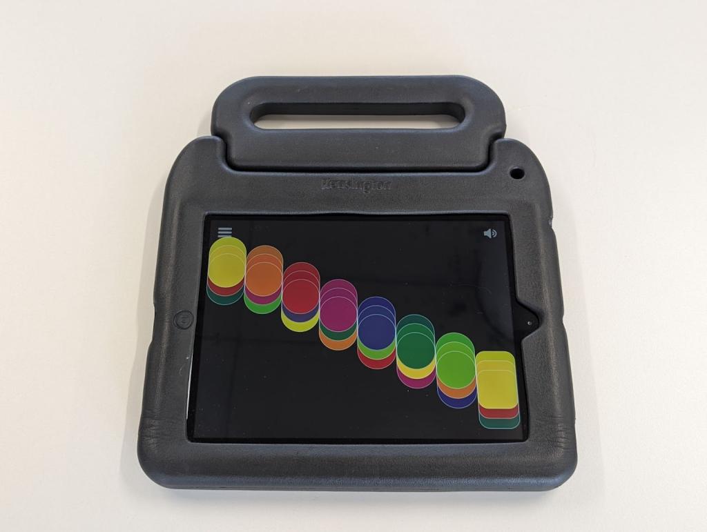 An iPad with the Clarion app open in a rugged, large black case with a large handle.